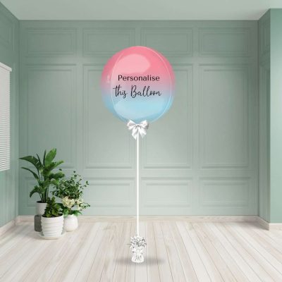 Round ombre pink and blue helium inflated foil balloon with a smooth colour gradient