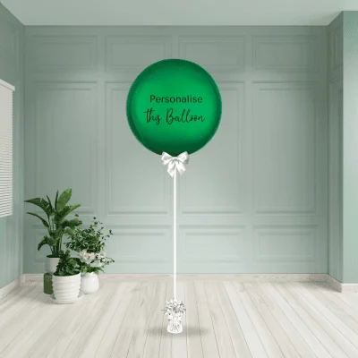 a green balloon in a room
