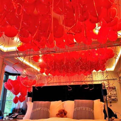 Valentine’s proposal ceiling balloons helium filled and styled for a romantic setting