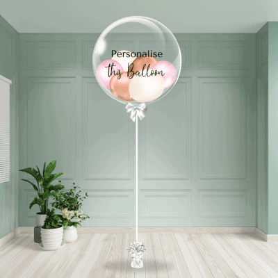 Delicate pink, rose gold and sand colour mix bubble balloon with space for personalised text, anchored to a graceful weight.