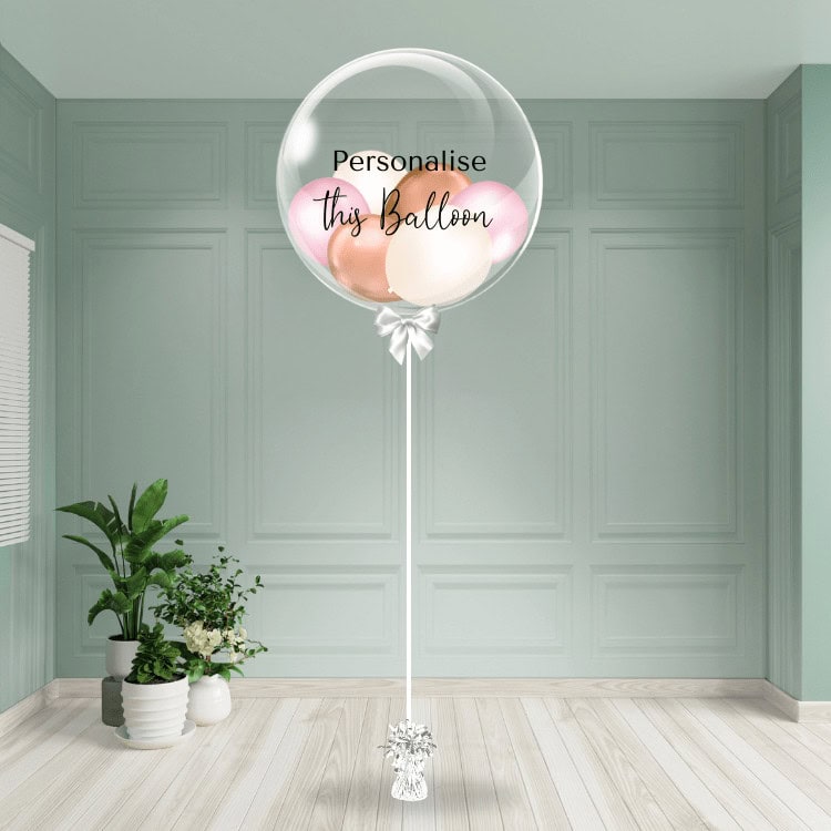 Delicate pink, rose gold and sand colour mix bubble balloon with space for personalised text, anchored to a graceful weight.