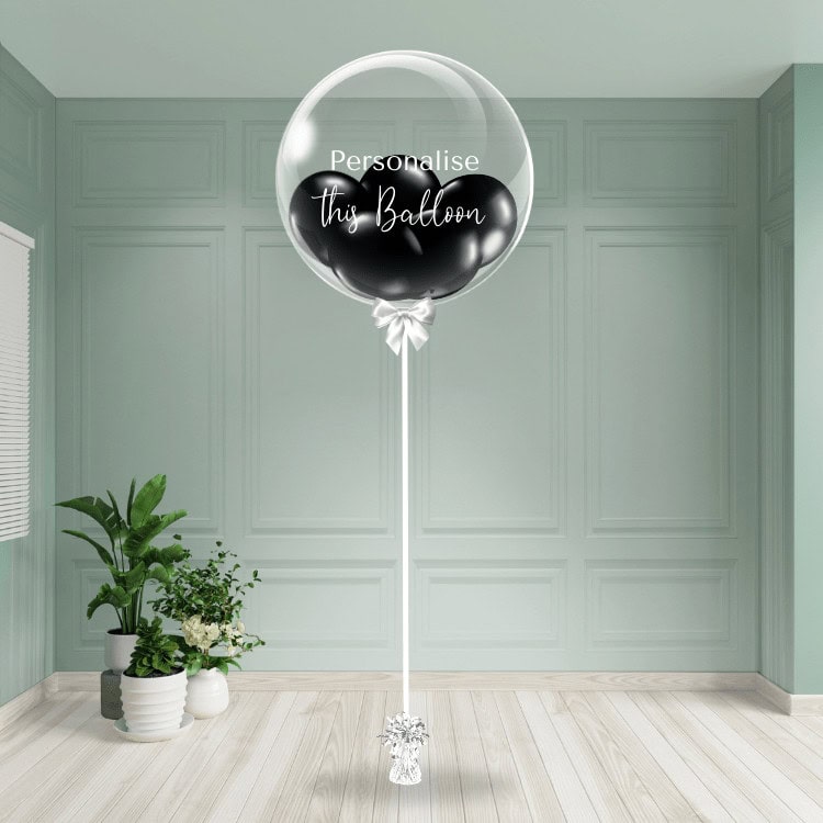 Elegant black bubble balloon with customisable text on a clear background, standing on a white pedestal.