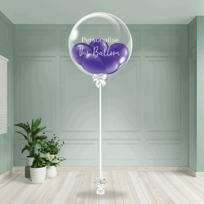 A purple bubble balloon ready for personalisation stands out in a neutral-toned room.