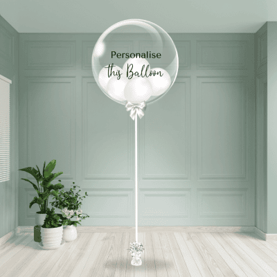 A classic white bubble balloon ready for personalisation adds a pure and chic touch to the room.