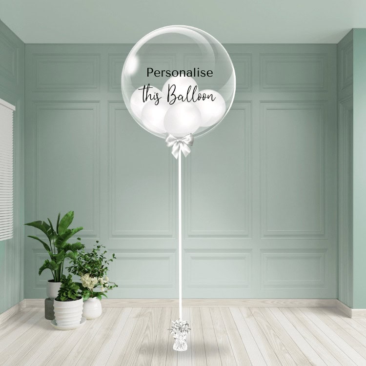A classic white bubble balloon ready for personalisation adds a pure and chic touch to the room.