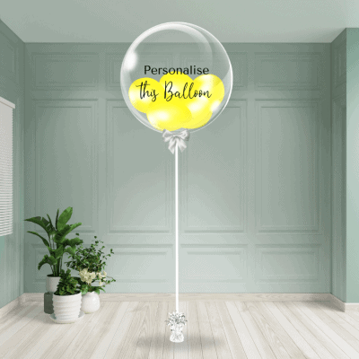 A personalised yellow bubble balloon stands out with its vibrant colour, offering a bespoke touch to your decor.