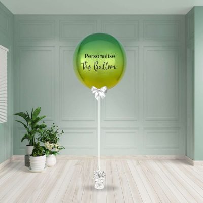 Round ombre yellow and green helium inflated foil balloon with a smooth colour gradient