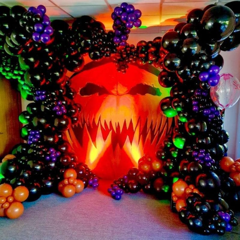 Luxury Halloween balloon display in red, orange, and black for a themed event