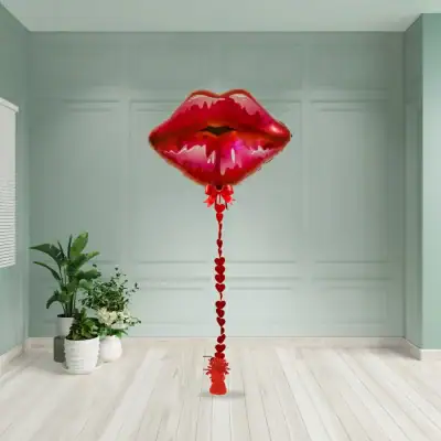 Red lips foil balloon with red heart ribbon tail and bow