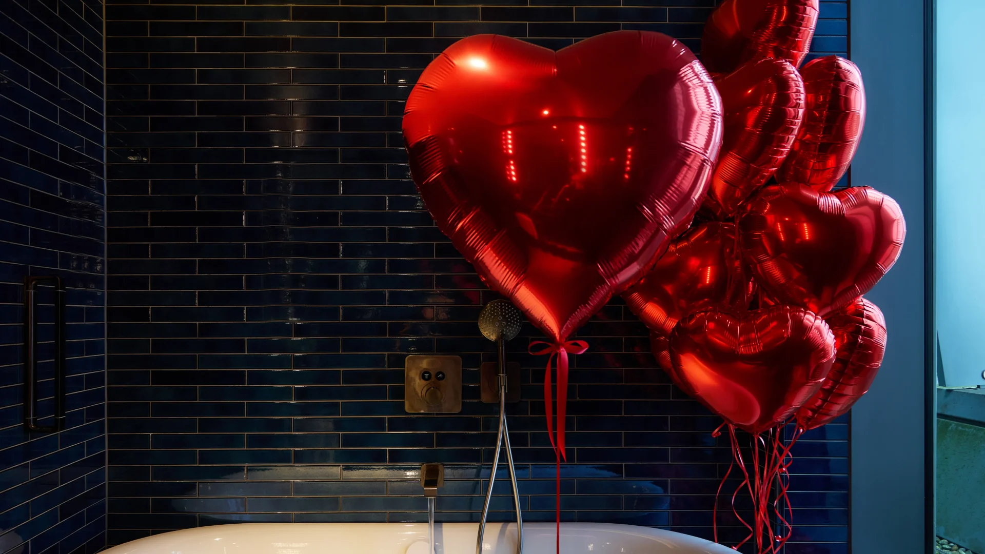 Luxury red heart Valentine’s balloon bouquet in a romantic luxury bubble bath setting