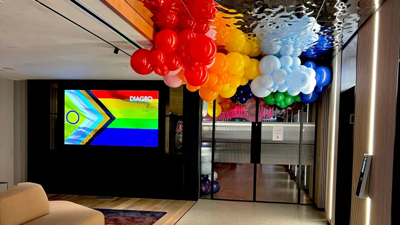 Rainbow balloon ceiling installation for Diageo Pride event